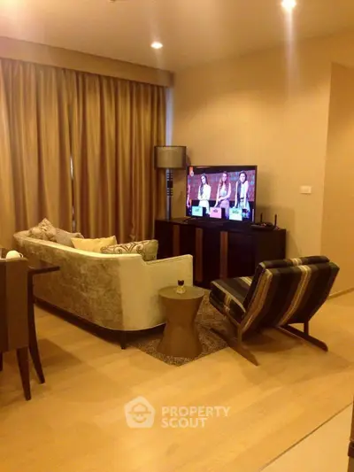 Elegant living room with modern furniture and cozy ambiance, perfect for relaxation and entertainment.