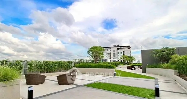 Luxurious rooftop garden with modern seating and stunning sky views.