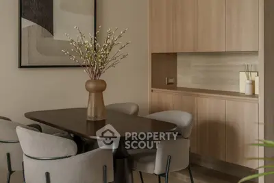 Elegant dining area with modern decor and wooden cabinetry, perfect for stylish gatherings.