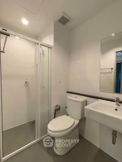 Modern bathroom with glass shower and sleek fixtures