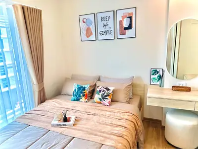 Modern bedroom with stylish decor and natural light