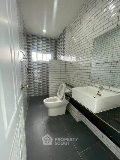 Modern bathroom with sleek tiles and contemporary fixtures