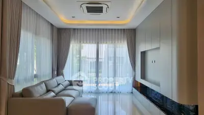 Luxurious modern living room with elegant curtains and plush sofa