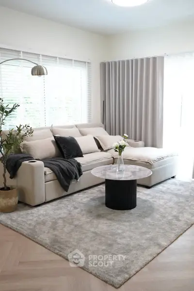 Elegant living room with cozy beige sofa and modern decor