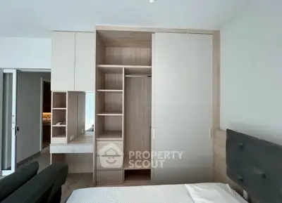 Modern bedroom with built-in wardrobe and sleek design