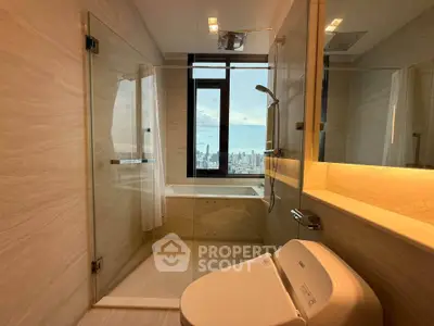 Luxurious bathroom with city view, featuring modern fixtures and elegant design.