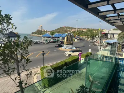 Stunning balcony view overlooking a scenic roundabout and coastal landscape.