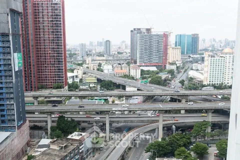 Stunning urban cityscape view showcasing modern high-rise buildings and intricate highway network.
