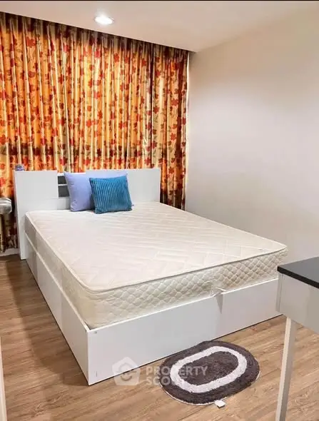 Cozy bedroom with stylish decor and comfortable bed in modern apartment.