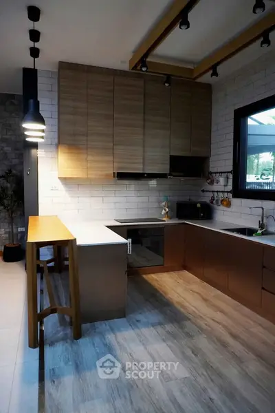 Modern kitchen with sleek cabinetry and open layout design