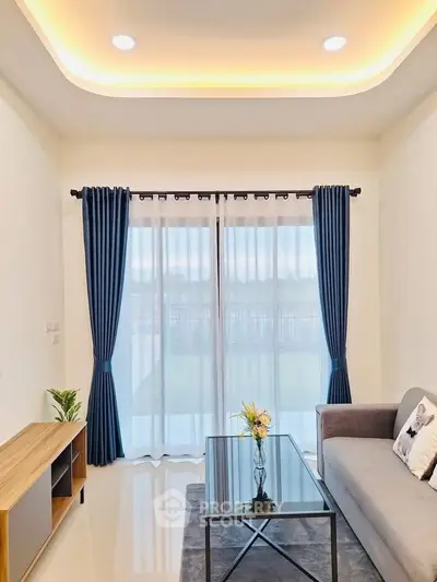 Modern living room with elegant decor and large window view