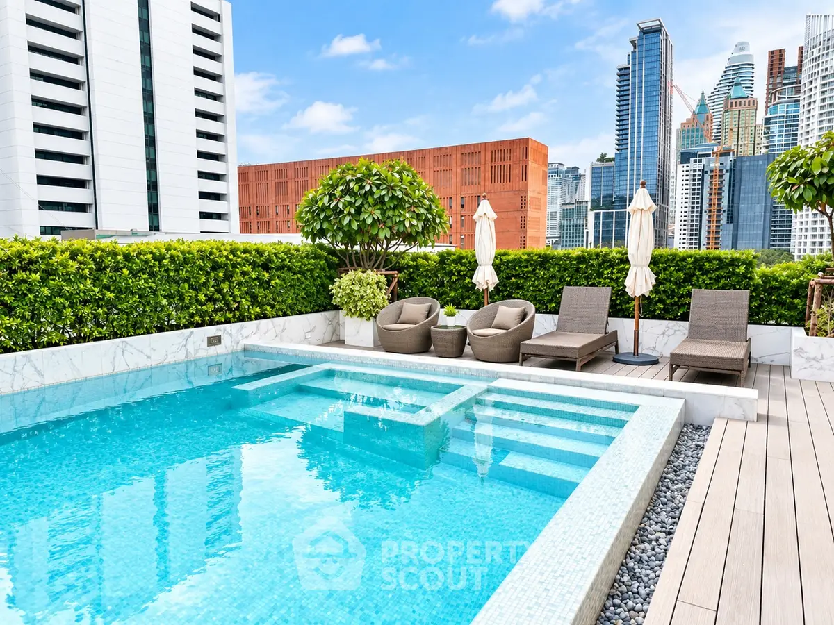 Luxurious rooftop pool with city skyline views and elegant lounge area.