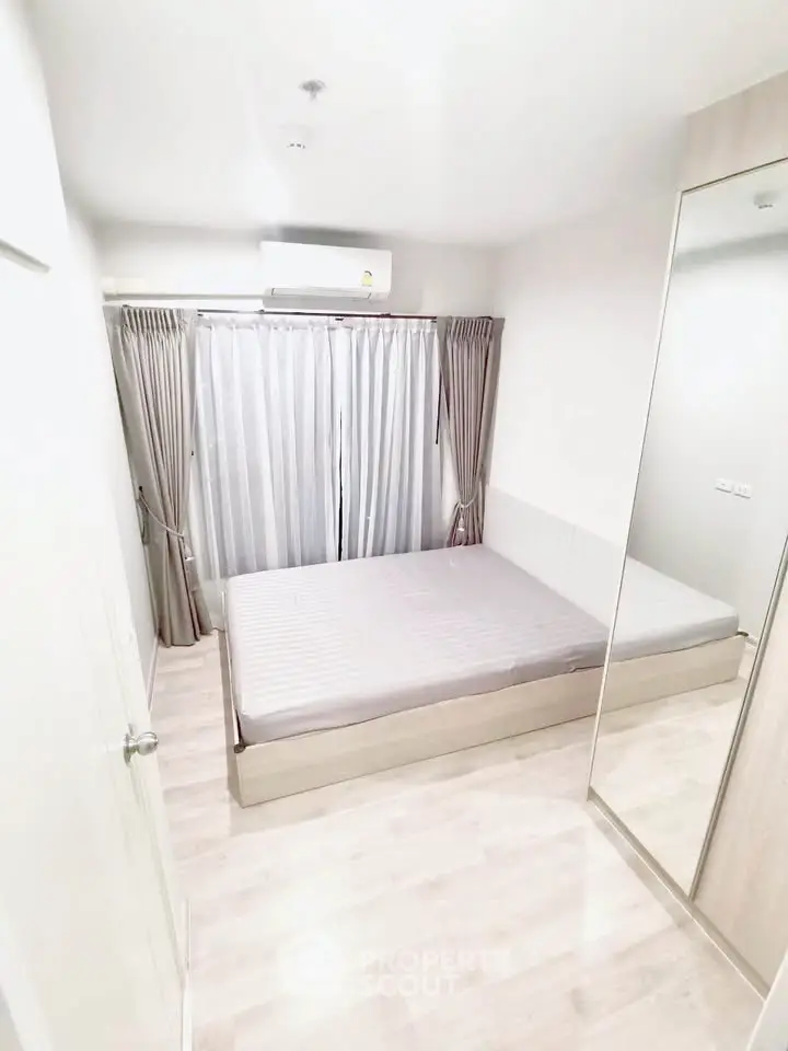 Bright and cozy bedroom with mirrored wardrobe and air conditioning