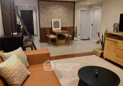 Stylish living room with modern furniture and cozy ambiance, perfect for relaxation and entertaining guests.