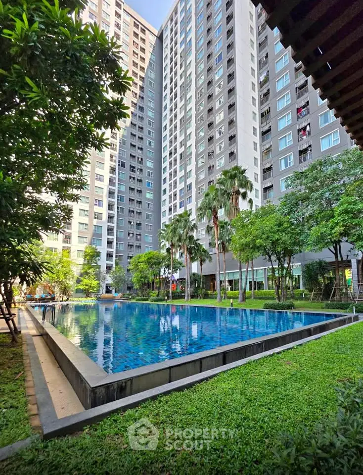 Luxurious high-rise apartment with stunning pool and lush garden view