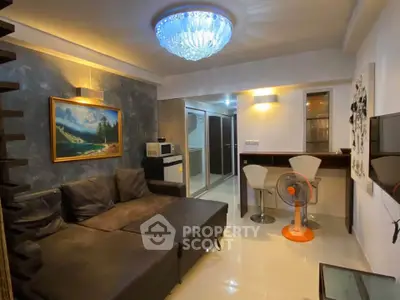 Stylish living room with modern decor and elegant lighting, perfect for relaxation and entertainment.