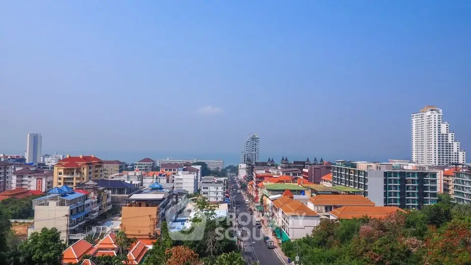 Stunning cityscape view with ocean backdrop and modern buildings