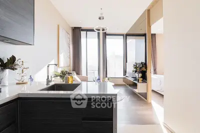 Luxurious modern apartment with open kitchen and stunning city view, featuring elegant decor and ample natural light.