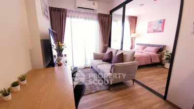 Modern studio apartment with cozy living area and stylish bedroom
