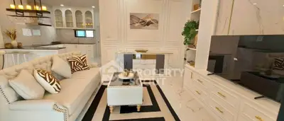 Luxurious living room with elegant decor and modern kitchen in open layout