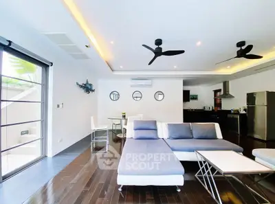 Spacious modern living room with open kitchen and stylish decor