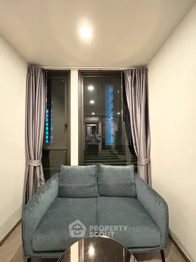 Cozy living room with modern sofa and elegant curtains