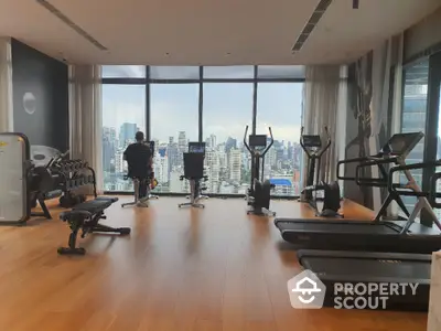 Luxury gym with panoramic city view and modern fitness equipment