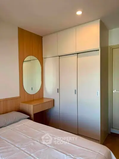 Modern bedroom with built-in wardrobe and stylish wooden accents