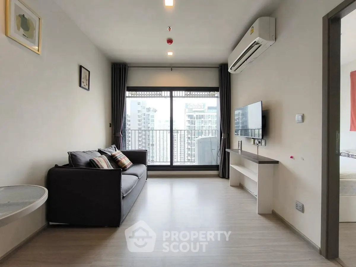 Modern living room with city view and sleek furnishings