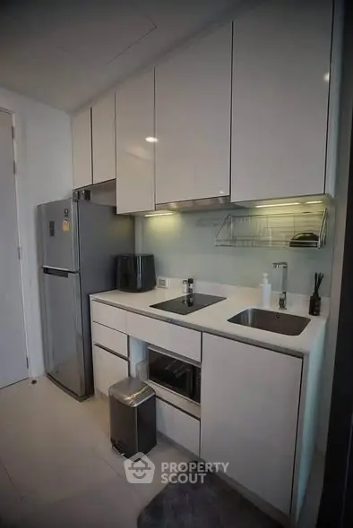Modern kitchen with sleek cabinetry and stainless steel appliances