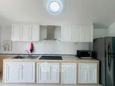 Modern kitchen with sleek cabinets and stainless steel appliances