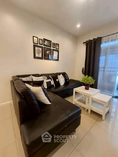 Stylish living room with modern black leather sofa and elegant decor
