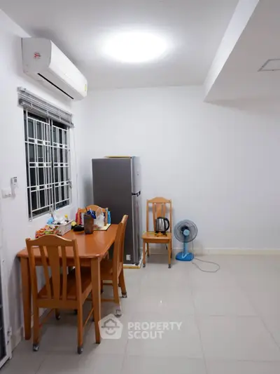 Cozy dining area with modern appliances and minimalist decor