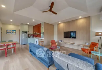 Modern living room with stylish furniture and open kitchen layout