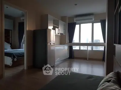 Modern apartment interior with open kitchen and city view