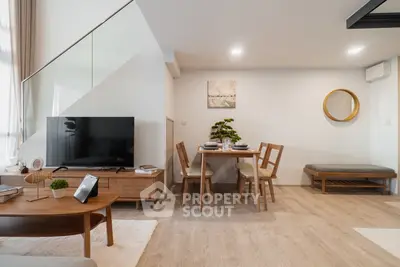 Modern living room with stylish furniture and open layout, perfect for cozy gatherings.