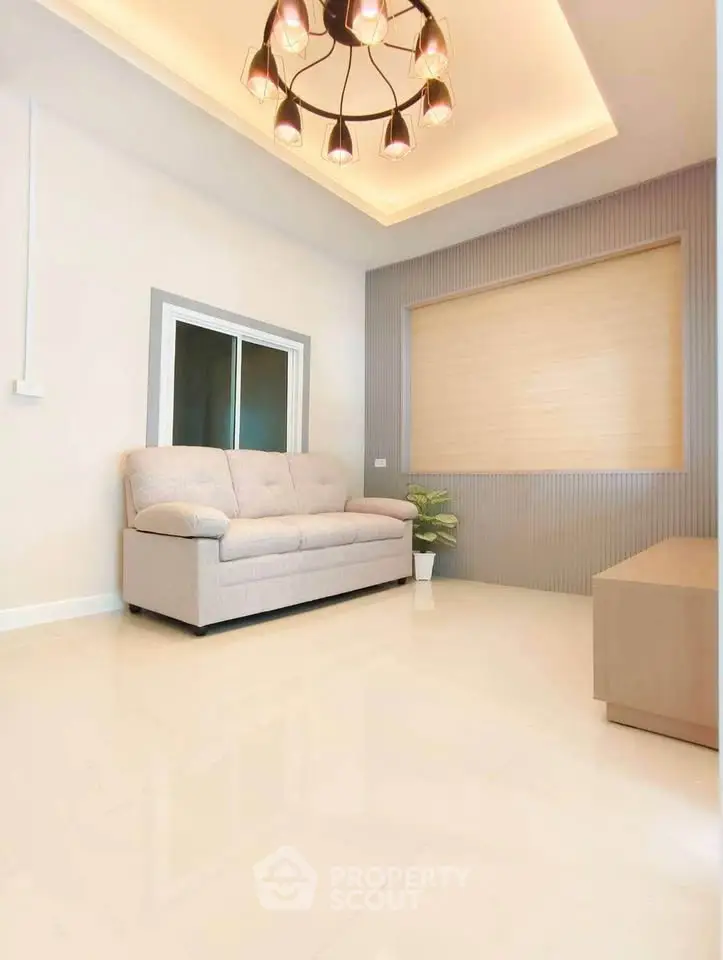 Modern living room with elegant lighting and cozy sofa in a stylish apartment.