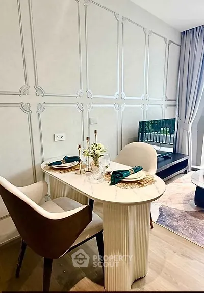 Elegant dining area with stylish chairs and marble table in modern apartment
