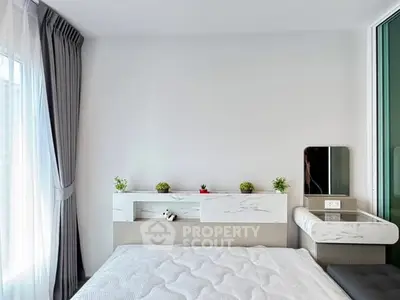 Modern bedroom with sleek design and natural light