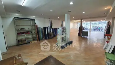 Spacious commercial space with tiled flooring and large windows