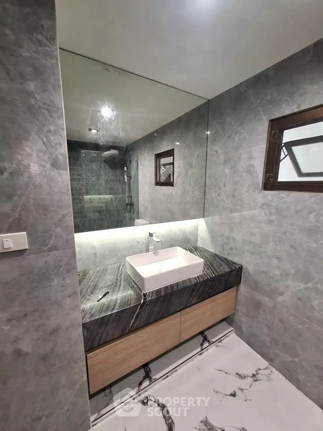 Luxurious modern bathroom with marble finishes and sleek design