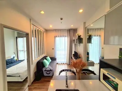 Modern open-plan living room with cozy bedroom and stylish decor