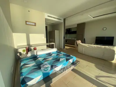 Modern open-plan studio with stylish decor and abundant natural light