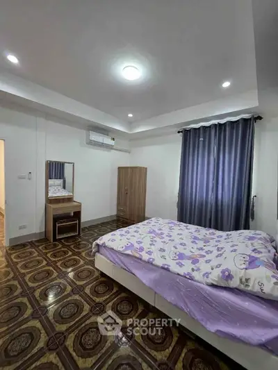 Cozy bedroom with stylish flooring and modern furniture