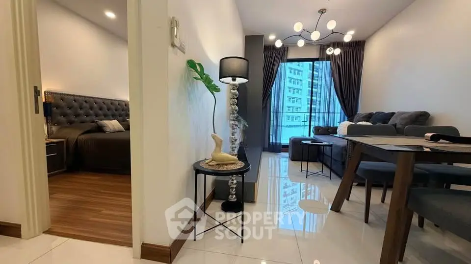 Modern apartment interior with stylish living room and cozy bedroom, featuring elegant decor and natural light.