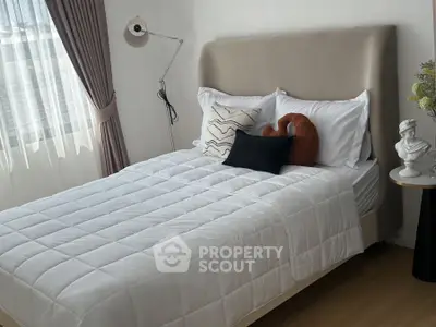 Cozy bedroom with stylish decor and natural light