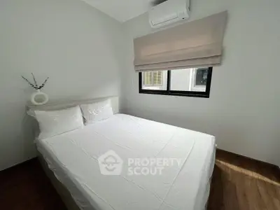 Cozy bedroom with modern decor and natural light