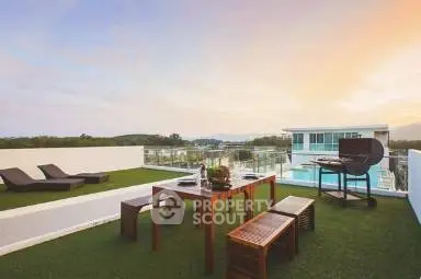 Stunning rooftop terrace with BBQ and scenic views at sunset