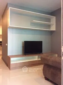 Modern living room with sleek TV stand and stylish shelving unit