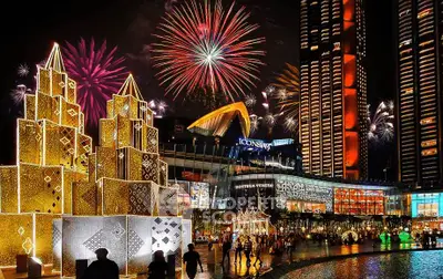Iconic cityscape with illuminated buildings and vibrant fireworks display